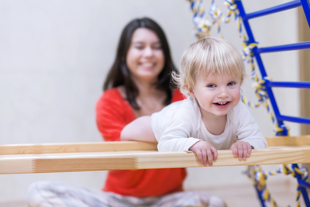 toddler on gym equipment