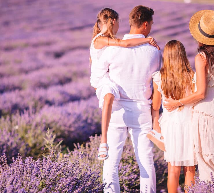 family standing in a lavender field