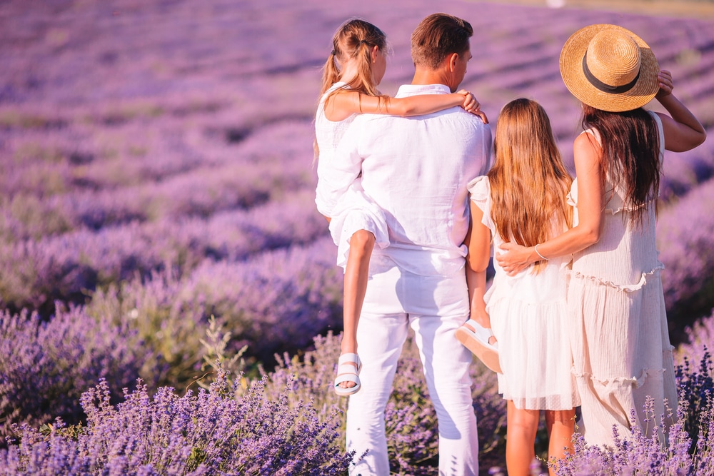 family standing in a lavender field