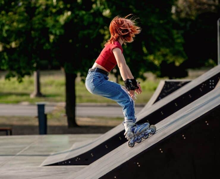 girl going up ramp on rollerskates