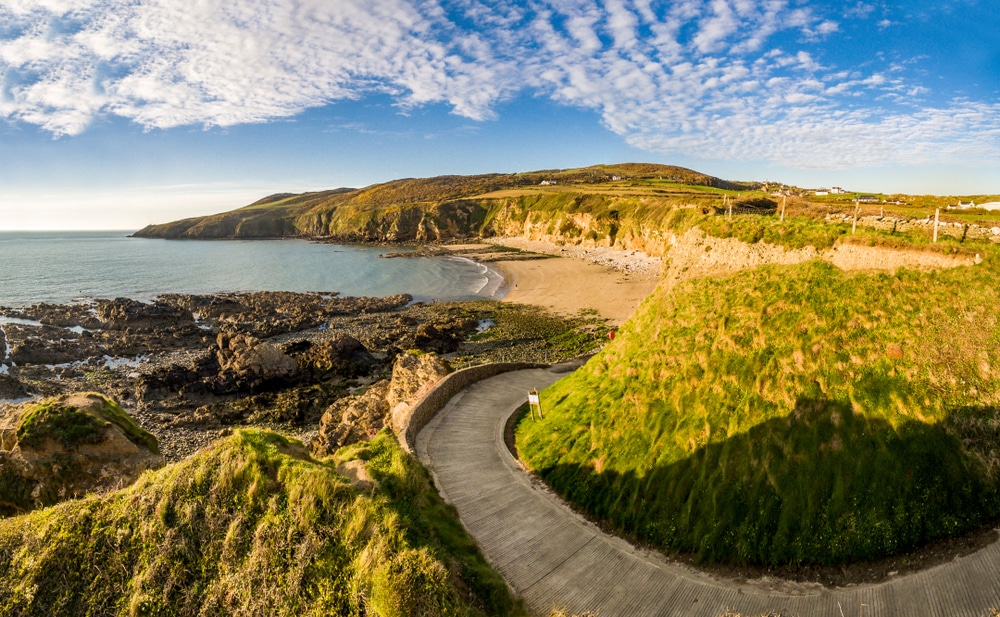 winding coastal paths across cliffs overlooking sea views at Church bay