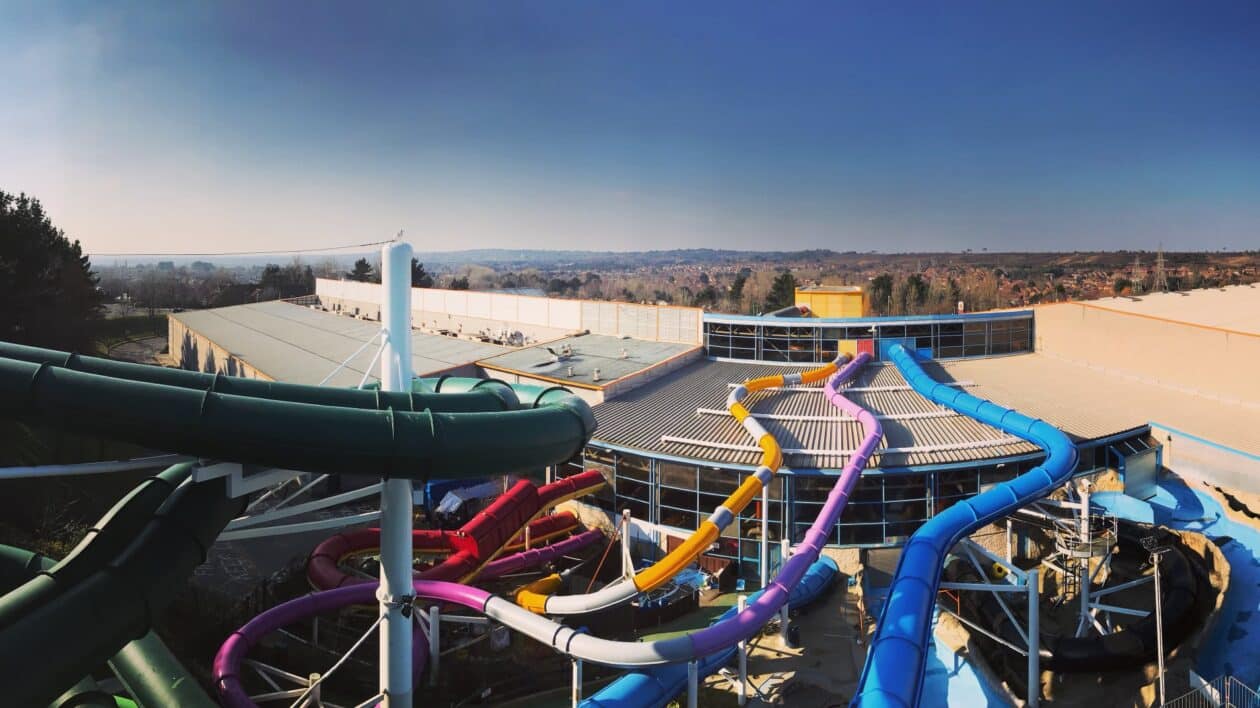mutli-coloured slides from the inside to the outside of the building at splashdown in poole.