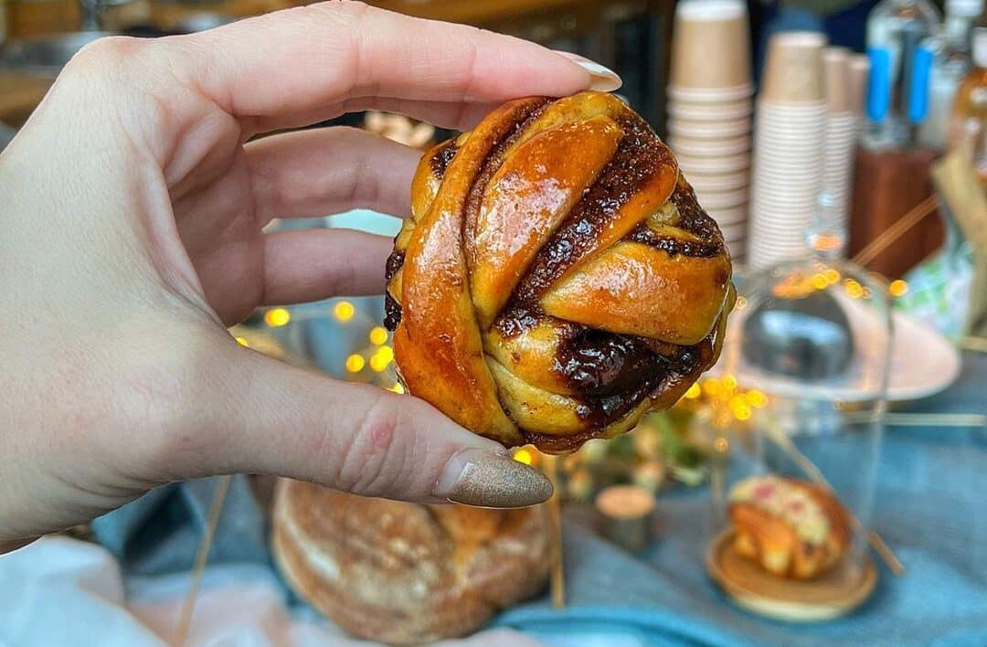 person holding small pastry