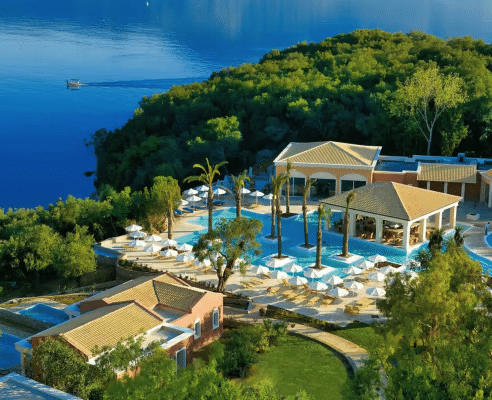 lush gardens surroundig the pool at the grecotel Eva Palace hotel