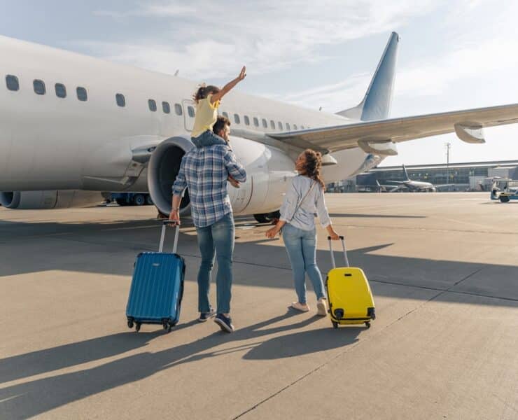 family walking to a plane