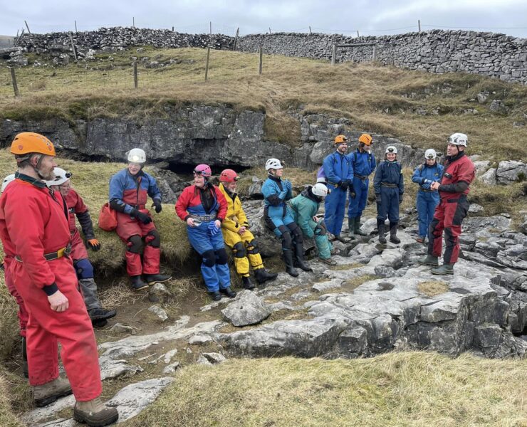 cavers waiting to go inside the gaping gill cave