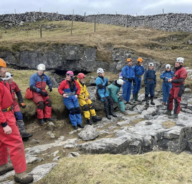 cavers waiting to go inside the gaping gill cave