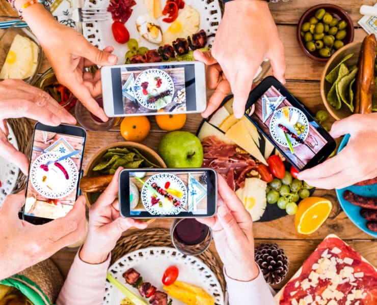 people taking pictures of their food