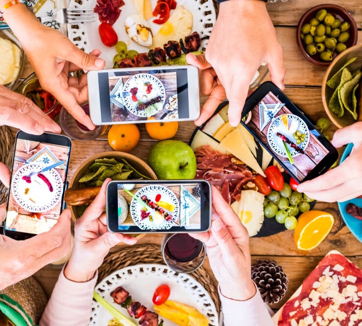 people taking pictures of their food
