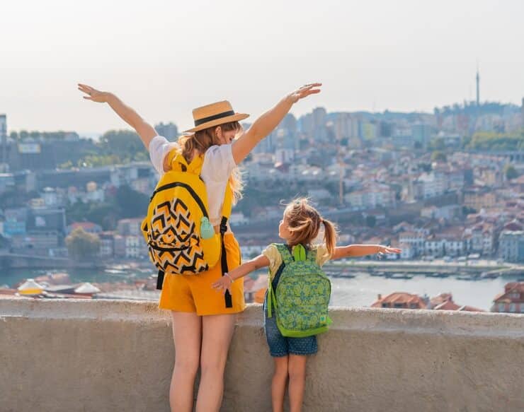 mother and child looking over into the city
