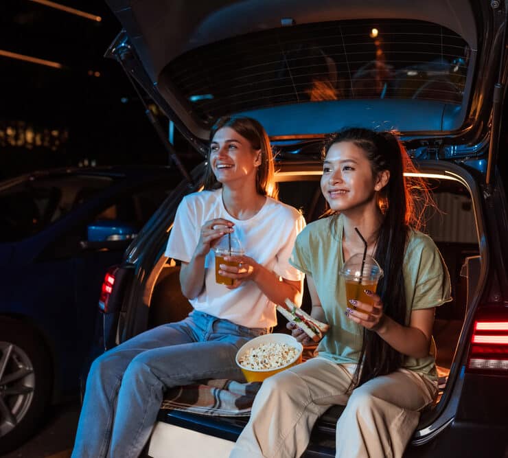 two girls enjoying a film