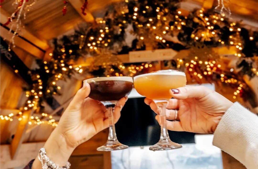 people toasting their seasonal cocktails in alpine shack