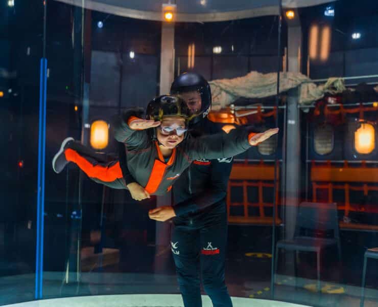 kid trying out the indoor skydiving session at bear grylls adventure