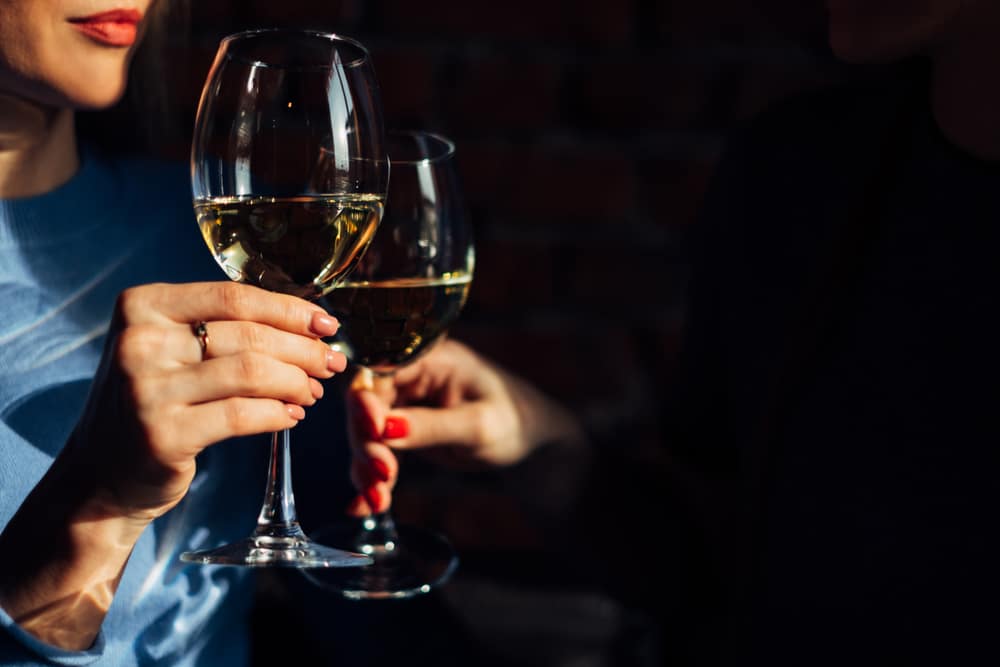 classy woman holding glass of wine