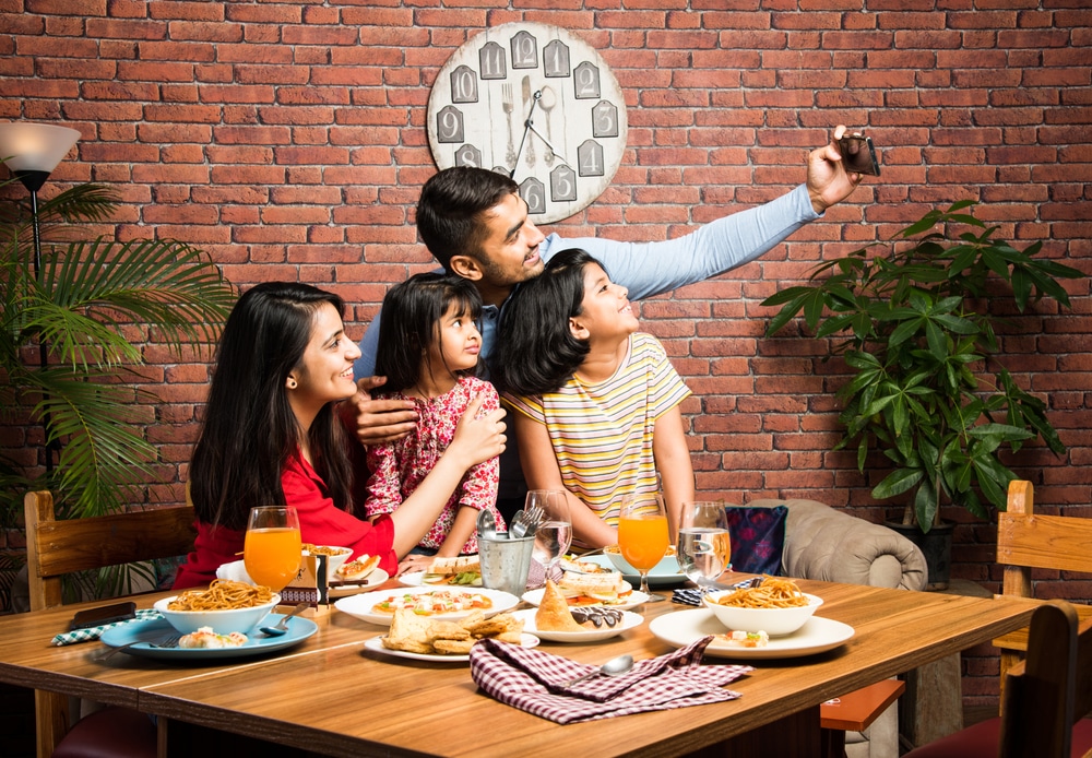 Family at restaurant with play area