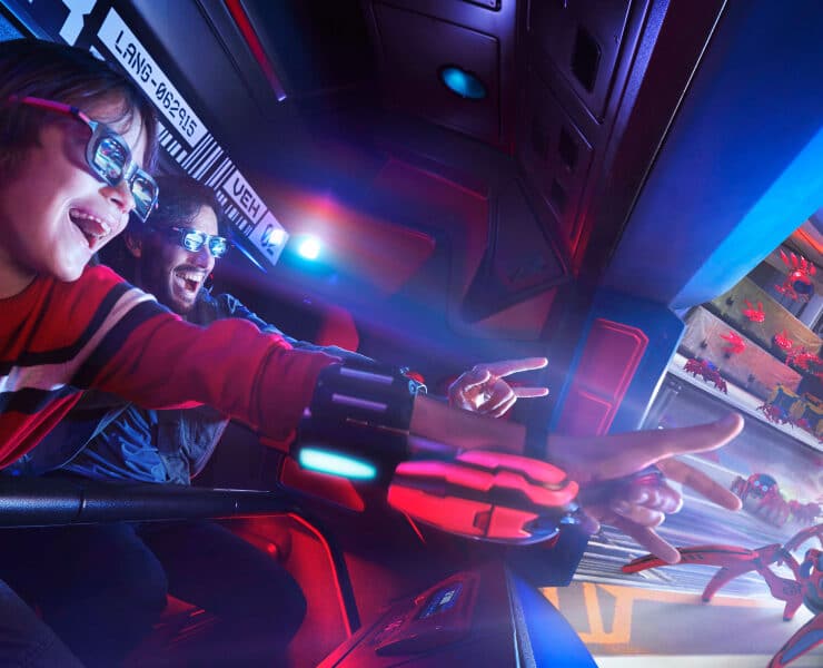 boy on the spidermand ride at disneyland paris