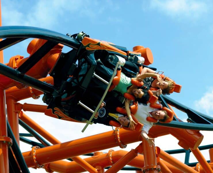 People on a rollercoaster's inversion