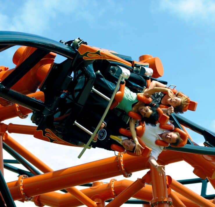 People on a rollercoaster's inversion
