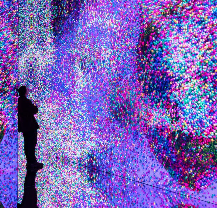 person looking at art exhibit at balloon museum