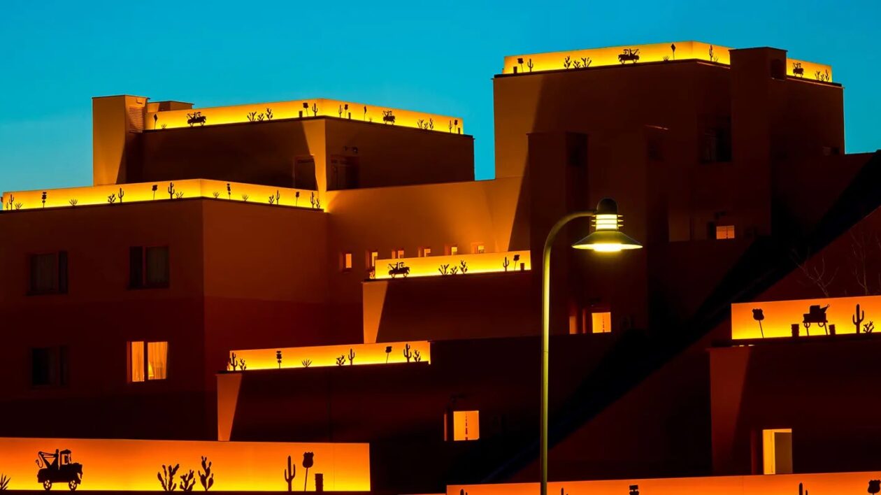 Hotel Santa Fe in the dark, with gold/yellow lights