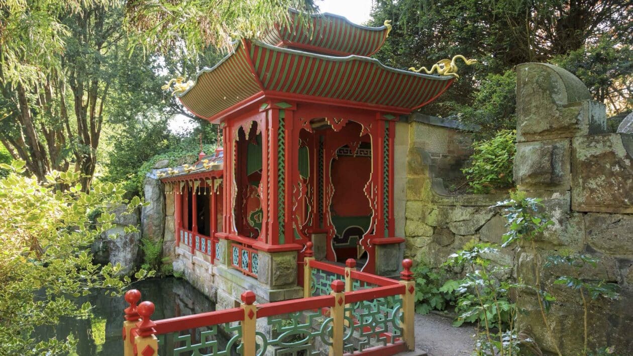 Red Chinese building amongst the trees