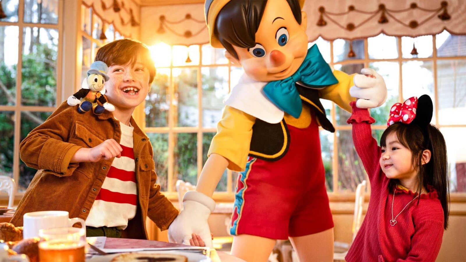 pinocchio dancing with a little boy and girl