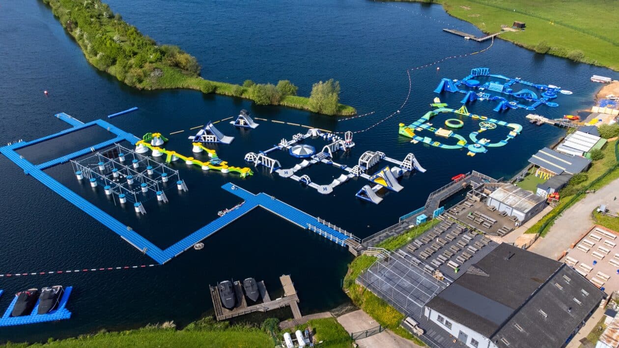 Birds Eye view of the inflatable courses on a lake at Cliff Lakes Aqua Park.