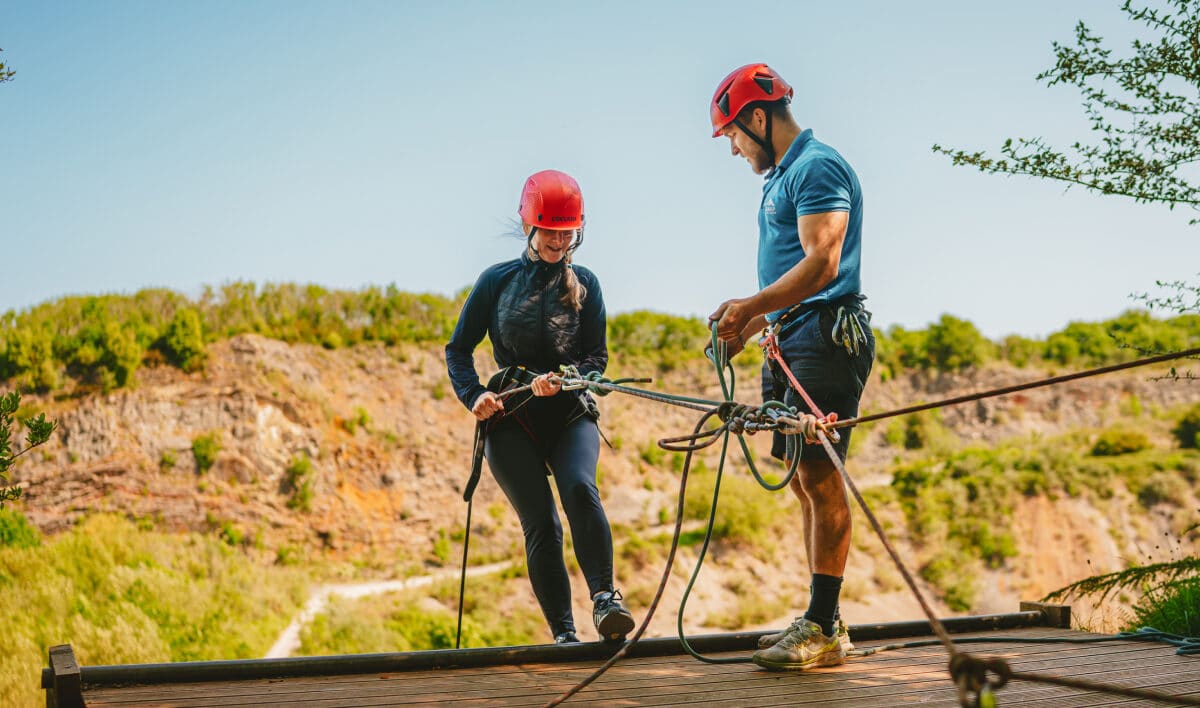 people abseiling down the hill
