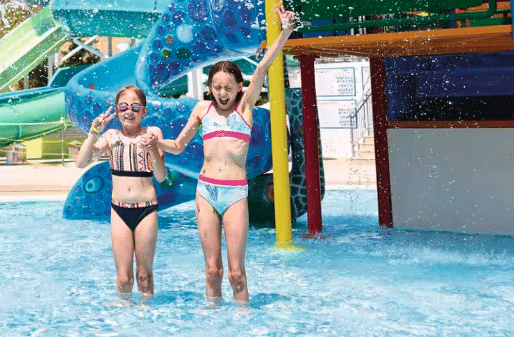 girls on holiday in the splash park